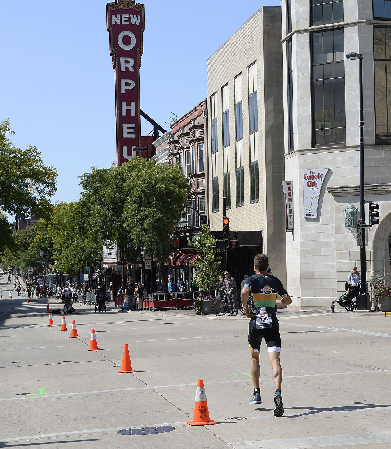 IRONMAN athletes run down State St.
